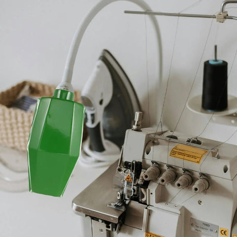 Workhorse Green Workbench Light Cover For Drill Press And Sewing Machine Shop Lamp Shade mounted over a sewing machine.