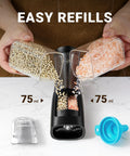 2 In 1 Rechargeable Salt And Pepper Grinder Set With USB C Charging Base being filled with salt and pepper, showing dual chambers.