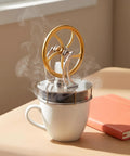 Low Temperature Stirling Engine Model Kit for Hands On Mechanical Skills and STEM Education with glass cylinder on a mug.