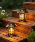 Two Pack Solar Lanterns Outdoor Waterproof Hanging Lights With Wall Hooks Retro Metal Lanterns on wooden steps at night