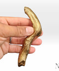 Hand holding branch shaped cabinet handle dope farmhouse vibe solid brass drawer pull with antique gold finish, rustic wood look hardware