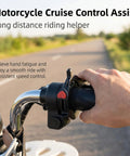 Heavy Duty Motorcycle Cruise Control Throttle Lock With Serrated Heart Push Button Nonslip Handlebar Mount shown on a bike handle.
