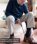 Elderly man using extendable magnetic flashlight tool as gift