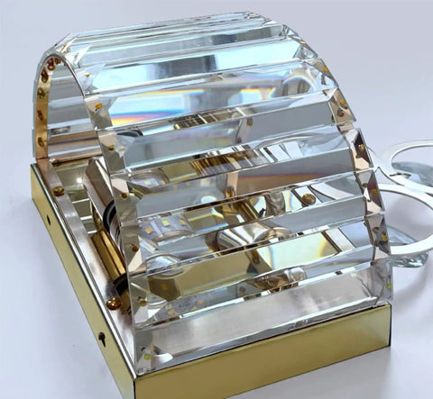 Close-up of Gold Crystal Wall Sconce with Beveled Prisms Dimmable 2 Light Premium Vibe Wall Lighting for Bedroom and Living Room.