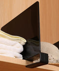 Black Acrylic Shelf Dividers Eight Pack for Closets and Shelves with towels and hats on wooden shelf