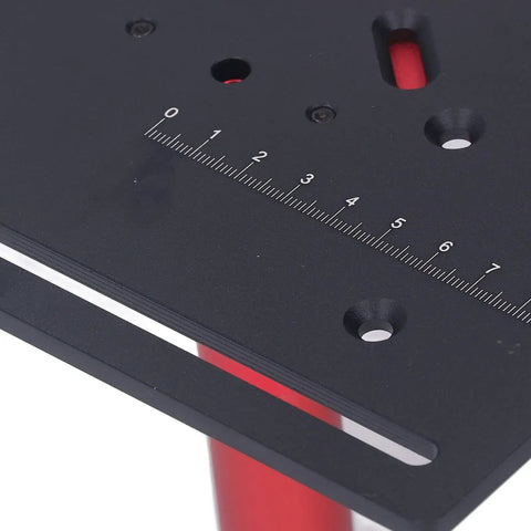 Close-up of Rock Solid Manual Router Uplift Kit for Woodworkers Seeking Hella Precise Height Adjustments, showing ruler and holes.