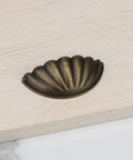 Four Pack Bronze Semicircle Cabinet Pulls Featuring Heavy Duty Zinc Alloy Build And Hella Tough Grip For Kitchen Drawers on wooden surface.