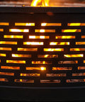 Fire burning in 26 Inch Wood Burning Fire Pit Table With Grill And Lid For Backyard BBQs And Bonfire Nights, close-up of metal design.