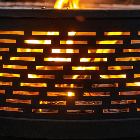 Fire burning in 26 Inch Wood Burning Fire Pit Table With Grill And Lid For Backyard BBQs And Bonfire Nights, close-up of metal design.