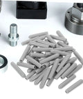 Huge Pack Of Dishwasher Rack End Caps And Tine Protectors Featuring A Hell Of An Easy Snap Installation For Modern Kitchens Solid Heavy Duty Replacement Parts That Really Fix Peeling Or Snapped Pegs In A Jiffy - gray plastic end caps piled with metallic tools.
