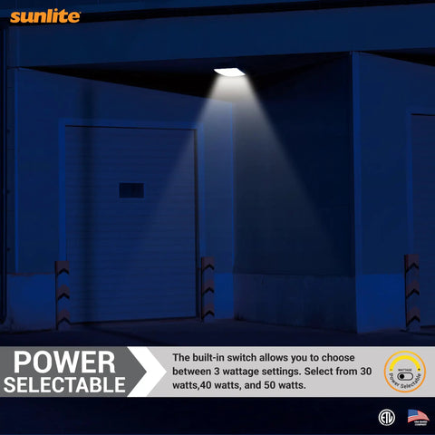 LED Outdoor Canopy Light Fixture With Power Selectable 30W, 40W Or 60W, 7800 Lumens illuminating a commercial doorway at night