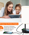 Multifunctional Table Lamp With 10W Fast Wireless Charger, USB Port next to two people using a tablet, in a living room setting.