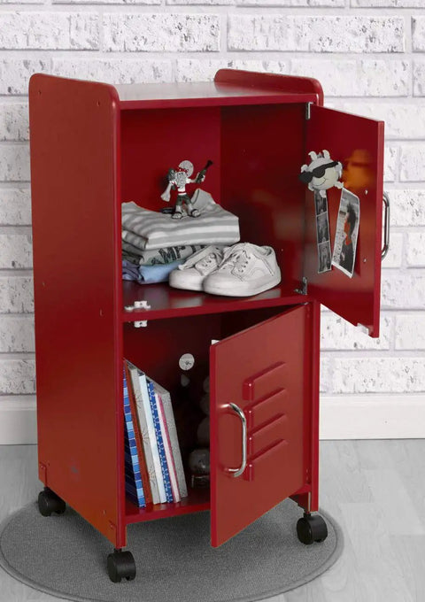 Red metal cabinet with open doors, showcasing shelves with books, toys, and shoes, on a grey rug in a brick-wall room.