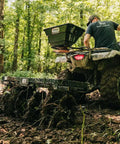 Tow Behind Notched Disc Harrow Attachment for ATV UTV 4 Ft Wide With 2 In Towball Hitch used in a wooded area