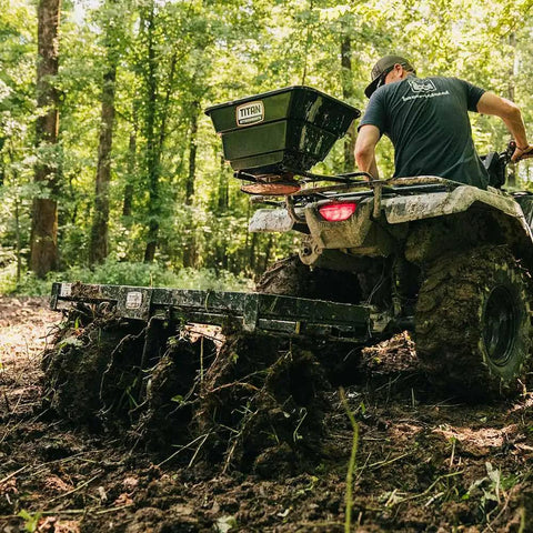 Tow Behind Notched Disc Harrow Attachment for ATV UTV 4 Ft Wide With 2 In Towball Hitch used in a wooded area