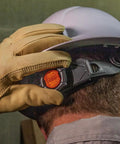 Worker adjusting strap on Rugged Worksite Ready Hard Hat With Rechargeable Headlamp Full Brim Non Vented Safety Helmet
