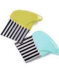 Two-piece stainless steel crinkle cutters with green and blue handles for vegetables.