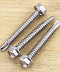Heavy Duty Workhorse Size Twelve X Two Hex Washer Head Self Drilling Screws, 410 Stainless Steel Tek Fasteners For Sheet Metal, pack of 25 screws on wooden surface.