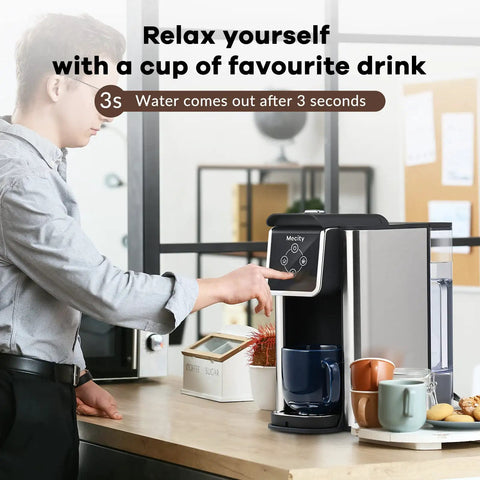 3 In 1 Single Serve Coffee And Tea Maker K Cup Compatible Fast One Touch Brew For 6, 8, Or 10 Oz Cups Removable 50 Oz Water Reservoir 120V 1150W Power Easy Office Or Home Use on a kitchen counter with a user pressing the button.
