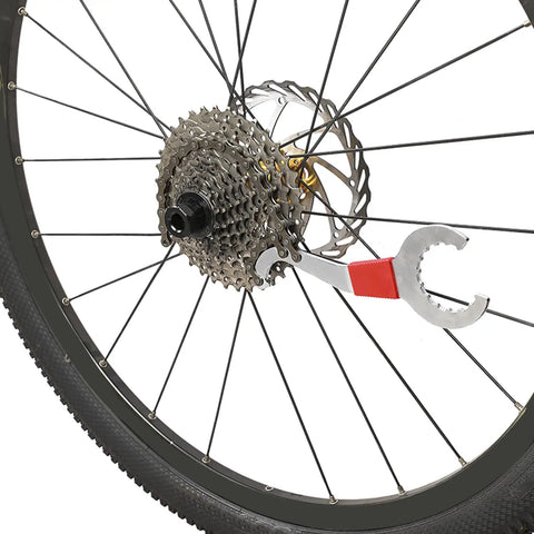 Six Piece Bicycle Repair Tools Kit For Mountain And Road Bikes, Pro Grade Cassette And Sprocket Removal Set tool on bike wheel