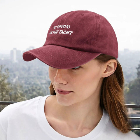 Wine Red Lightweight Women's Dad Hat With Six Ventilation Eyelets, Low Profile Unstructured Cap worn by woman outdoors