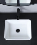 Top view of the Vessel Sink 22 x 15 Inch White Ceramic Above-Counter Bathroom Sink on a black vanity.