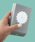 Hand holding 2 Inch Scallop Circle Paper Punch for Scrapbooks and Card Making, metal craft punch with stackable design, gray finish