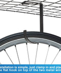 Close-up of bike wheel hanging from 12 Pack Garage Storage Hooks With Screws For Ceiling Racks on metal rack
