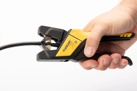 Automatic Wire Stripper For 6 To 16 AWG Cables, Pro Grade Hand Tool in use stripping cable insulation, German Made Quality