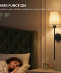 Konvixon Wall Sconces Battery Operated Set of Two, RGBWW with Remote, Black illuminating a bedside, creating warm ambiance.