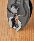 TwinGrip Pliers 6 Inch With Front And Side Jaws gripping a screw in wood, showcasing precision and strength.