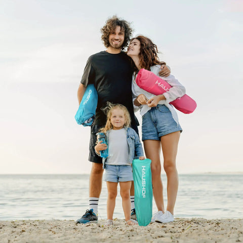 Family holding Low Beach Chair With Mesh Back And Cup Holder, Foldable Camp Chair For Outdoor Use on the beach