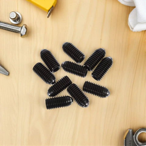 10PC Carbon Steel Ball Head Spring Plunger Grub Screws Featuring Knurled Caps And Load Bearing Springs on a wood surface.