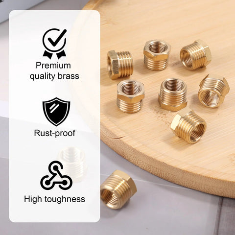 Nine brass NPT reducer bushings, 1/4 inch male to 1/8 inch female, plumbing fittings (close-up)