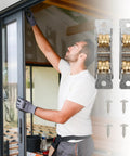 Man installing Built Tough Double Wheel Sliding Patio Door Rollers With Stainless Steel Pulley Set, showing smooth sliding action.