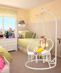 Bohemian Macrame Hammock Chair Swing With Hardware Kits For Indoor And Outdoor Use Ideal For Balcony Porch Yard Or Bedroom Cozy Supportive Knitted Seat With 265 Pound Capacity And Easy Hanging, installed in a bedroom with child reading on it.