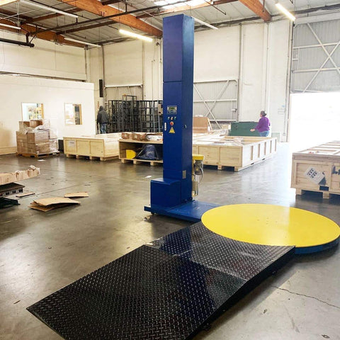 No Nonsense Heavy Duty Pallet Wrapping Machine With Industrial Shrink Wrap And Precision Built In Scale Plus Extra Wide Anti Slip Roll On Ramp Kit Built Tough For Warehouse Hustle in industrial setting.