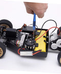 Person using RC Car Screw Kit With Replacement Hardware Fasteners Set 1216-17 1218 1219 Comes With Wrench And Nuts For Quick On The Go Maintenance And Repair Of Your RC Ride In A Compact Organized Case on an RC car motor section