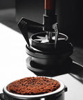 Stainless Steel Espresso Wdt Tool Needle Coffee Distributor With Rugged Stand Base breaking clumps of ground coffee.