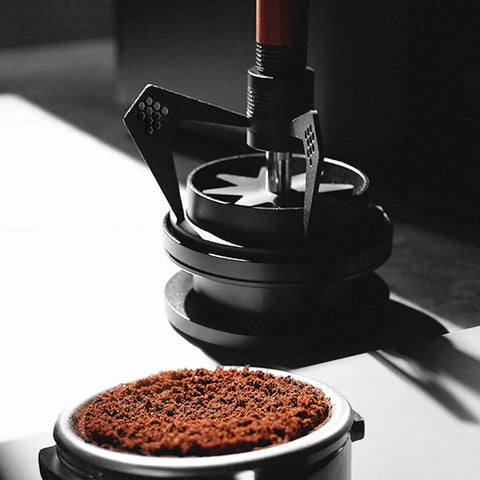 Stainless Steel Espresso Wdt Tool Needle Coffee Distributor With Rugged Stand Base breaking clumps of ground coffee.
