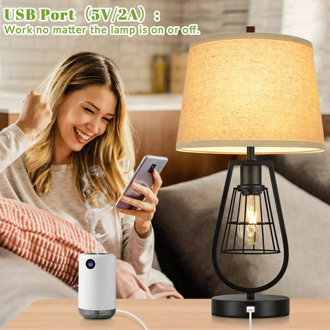 Woman smiling with Industrial Touch Table Lamp with USB Port, 3-Way Dimming, cream fabric shade, black metal base beside her