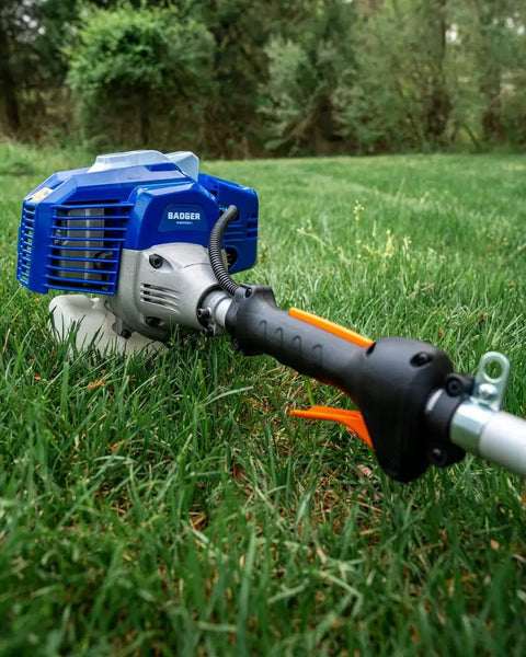 Close-up of Gas Powered 26cc Weed Wacker 3 In 1 String Trimmer Edger With 10 Inch Brush Cutter And 17 Inch Cutting Width on grass