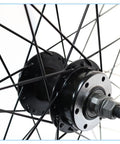 Close-up of Stainless Steel Bike Spokes And Nipples 12G 130mm Black 10 Pack for Mountain Road and Hybrid Bikes on wheel hub.