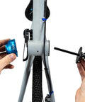 Hands using Bottom Bracket Retaining System With Double Sided Adapter Nut For Cartridge BBs No Slip Clamping on bike
