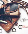 Purse with 24 Pack Mini Locking Carabiners For Keychains Rings 1.0 Inch Small Clips set in gold, silver, black on display