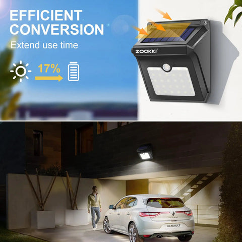 Solar Outdoor Motion Sensor Lights 120 Degree Wide Illumination IP65 Waterproof Wireless Security Lighting For Garden Fence Patio Deck 28 LEDs 4 Pack No Fuss Setup Rechargeable Solar Powered Easy Install illuminating garage at night with car parked.