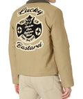 Back view of N1 Deck Lucky Bastard Denim Jacket With Vintage Acid Wash In Tan Color, showcasing large embroidered patch.