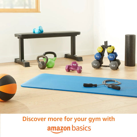 Rock Solid Cast Iron Kettlebell Thirty Five Lb Weight With Wide Comfort Grip on gym floor surrounded by other weights and equipment.