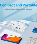 Flat Plug Power Strip With 3 Outlets And 3 USB Ports, 4 ft desk charging station next to a phone and card on a table