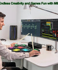 User playing Roll Up 9 Pad MIDI Electronic Drum Set With Headphone Jack Built In Dual Speakers at desk setup with monitors